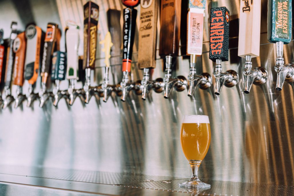 Beer glass under beer taps