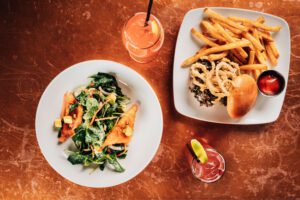 Image of crispy rice salad, truffle mushroo, burger and 2 cocktails