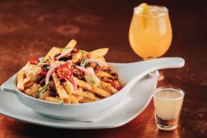 Trophy fries with a Golden Ball Cocktail and a Penalty Shot